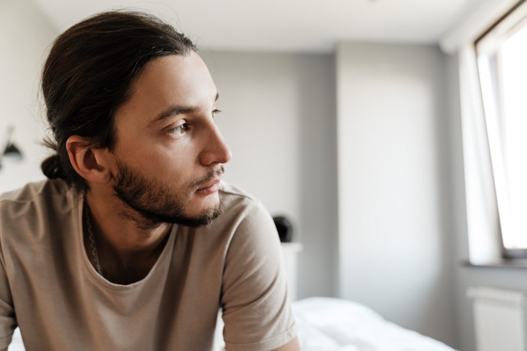 young man in depression sitting on bed 2021 08 29 12 59 11 utc