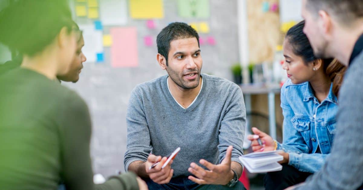 people discussing in a circle